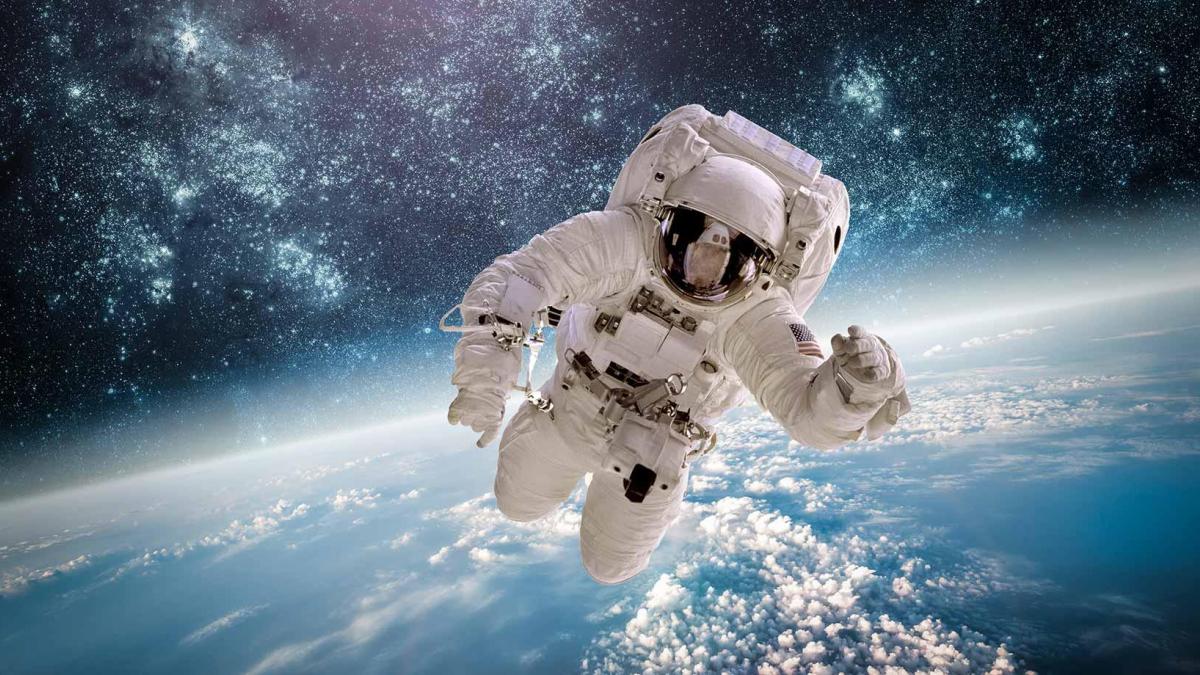 Astronaut Floating in Space above Earth